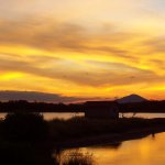 Panoramic sunset at Salinera Santa Alejandra and lagoons where shorebirds nest and feed